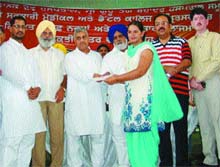 Tikshan Sood, Minister for Medical Education and Research, hands over appointment letter to a selected candidate at a function in Amritsar