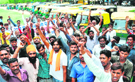 Auto-rickshaw drivers protest against the STAs challan drive in Sector 17, Chandigarh, on Friday.