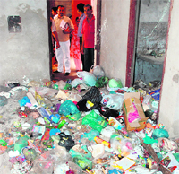 A heap of garbage inside a flat at the Chandigarh Apartments in Dera Bassi on Friday.