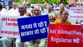 Members of various co-operative group housing societies of Dwarka along with BJP activists demonstrate against the Delhi government for delay in allotment of flats in Dwarka, at Jantar Mantar in New Delhi