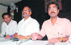 Dr Krishan Murari Gupta, chief of the Ayurvedic Chikitsa Chhatar Sangh (right) addresses media persons in Dehradun on Friday.