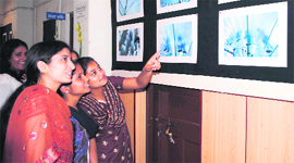 Visitors at a photo exhibition held at the Uttaranchal Grameen Bank on its Foundation Day in Dehradun.