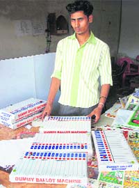 A vendor displays dummy EVMs at his shop in Karnal