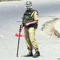 A policeman on patrol in Srinagar