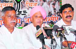 BJP MLA Ashok Khajuria along with other MLAs addresses mediapersonsin Jammu on Friday.