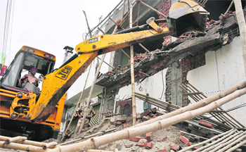 A demolition drive in progress at Upkaar Nagar in Ludhiana