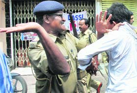 A policeman slaps one of the ABVP protesters staging a demonstration against Wednesday's police lathicharge on their colleagues in Ranchi,in Jamshedpur on Friday.