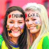 Two Brazilian supporters pose for the cameras before their match against Netherlands