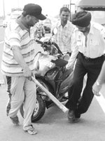 Police officials remove the scooter, which met with an accident on the Zirakpur flyover