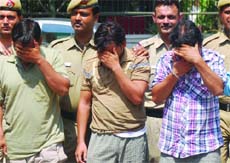 The three accused in police custody in New Delhi on Saturday. 