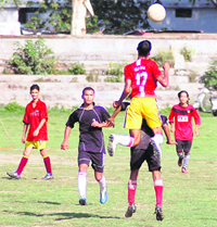 A match in progress at the Promotional Football Tournament in Dehradun on Saturday.