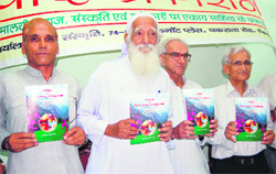 Environmentalist Sunder Lal Bahuguna releases a book of the DHAD Publication in Dehradun