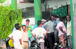 People gather outside the house of one of the victims in Nakodar on Saturday