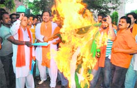 Workers of the Bajrang Dal and the Vishwa Hindu Parishad burn a Pakistan flag in the wake of repeated attacks on Amarnath pilgrims, at Sector 22, Chandigarh, on Sunday