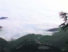 A view of the Doon Valley covered under thick monsoon clouds 