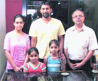 Indian cricketer Praveen Kumar with fans during his brief stay in Haridwar on Sunday. 