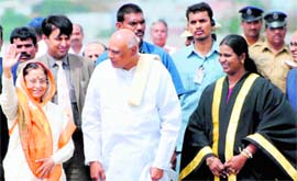 President Pratibha Patil waves as Andhra Pradesh Chief Minister K Rosaiah 