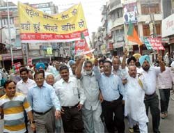 SAD (B) and BJP activists taking out a protest march. Essential services, however, remained unaffected