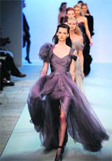 Models present creations by French designer Christophe Josse during the Fall-Winter 2010-2011 Haute Couture collection show in Paris on Monday.