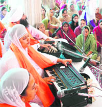 Devotees pray on the occasion of the birth anniversary of Guru Hargobind at Gurdwara Chatti Pathshai at Talab Tillo in Jammu on Monday.