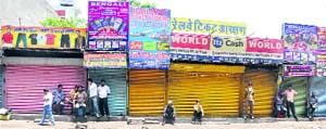 Shops remained closed throughout the day near the railway station during the bandh in Ludhiana on Monday; (and right) mounted police mans a road