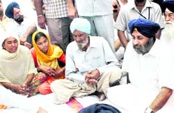 Deputy Chief Minister Sukhbir Singh Badal at the house of CRPF jawan Jarnail Singh, who was killed in a Naxal attack in Chhattisgarh, in Badha village near Fazilka on Monday