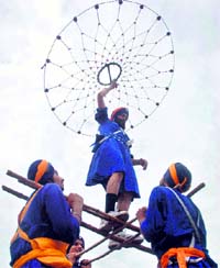 Devotees perform Gatka during a nagar kirtan procession to mark the birth anniversary of the sixth Guru, Guru Hargobind ji, in Patiala on Monday