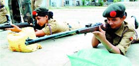 NCC girl cadets practise shooting at an annual training camp organised by the First Punjab Girls Battalion NCC in Mall Road School in Amritsar. 