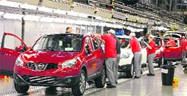 In this file photo, a worker is seen completing final checks on the production line at Nissan car plant in Sunderland, northern England. New car registrations in Britain rose 10.8 per cent in June to 195,226 vehicles, their 12th successive monthly increase, the Society of Motor Manufacturers and Traders said on Tuesday