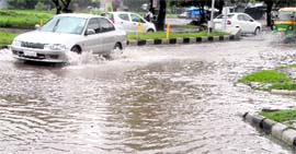 Water accumulated on the road separating Sectors 46 and 47 in Chandigarh on Tuesday