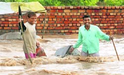 A vendor collects his goods at Jharmadi village in Lalru on Tuesday