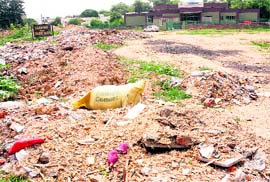 Debris lies in front of the Society for Rehabilitation of Mentally Challenged (SOREM) building in Sector 36