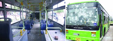 The low-floor Delhi Transport Corporation buses that were damaged during a protest by Kondli residents against shortage of water in the area, on Tuesday.