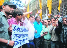 Members of the Uttarakhand Jan Sena hold a demonstration in front of the District Magistrates office in Dehradun
