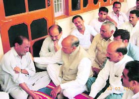 Chief Minister PK Dhumal consoles the family members of Pankaj, a CRPF jawan, at his native village near Dehara Gopipur, who was killed by the Naxals in Chhattisgarh last week