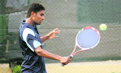 Vishwesh Sinha plays a backhand during a match of the HTA-AITA Mens and Womens Tournament-2010 in Ludhiana on Wednesday.