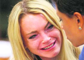 Actress Lindsay Lohan reacts after the sentencing during a hearing in Beverly Hills