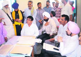 A lok adalat in progress at Peshawal village in Kaithal