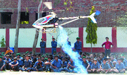 NCC cadets watch a remote-controlled helicopter of the Air Force during the annual training camp in Amritsar 