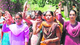 Demanding admission, candidates protest at Government College for Women at Gandhi Nagar in Jammu on Thursday.