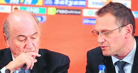 FIFA president Joseph Sepp Blatter (L) listens to secretary general Jerome Valcke during a press conference in Johannesburg on Thursday.