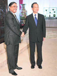 Pakistan President Asif Ali Zardari and Chinese PM Wen Jiabao shake hands during their meeting at Zhongnanhai in Beijing on Thursday.