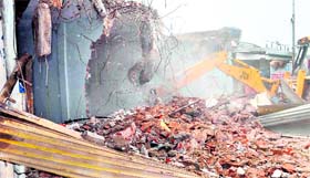 An illegal structure being razed in the Budhanpur area, opposite Sector 16, in Panchkula on Friday.