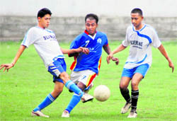 Players vie for the ball at a match during the Lala Nemi Dass District Football League in Dehradun on Friday