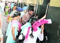 Heavy rush of passengers at the Ludhiana railway station on Friday. 