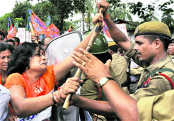 BJP activists clash with the police during a protest rally against price rise and other issues in Guwahati on Friday