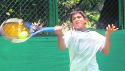 A player in action during a tennis match in Chandigarh on Saturday. 