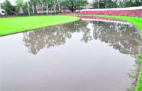 A view of the wet athletics track. Tribune photo: Manoj Mahajan