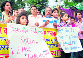 Residents hold a candle march, to demand the release of Sandeep Dangwal from Somali pirates, in Dehradun on Saturday