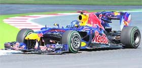 Red Bulls driver Sebestian Vettel drives at the Silverstone circuit during the second free practice session of the Formula One British Grand Prix on Saturday.